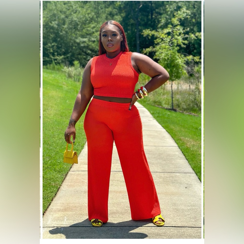 Two piece pants set still in the plastic with tags.